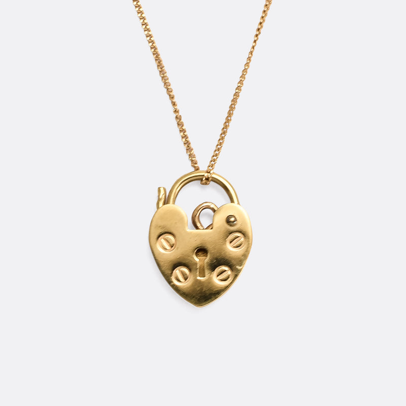 Sold at Auction: A 9K Yellow Gold Heart Locket Pendant on a 9K